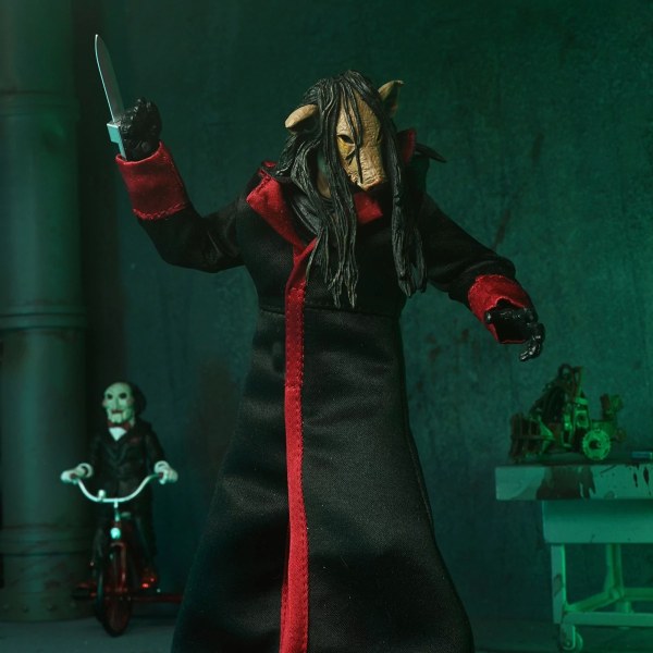 SAW (FRANQUICIA) - FIGURA DE ACCIÓN A ESCALA DE 7” - ULTIMATE JIGSAW KILLER (TÚNICA NEGRA)