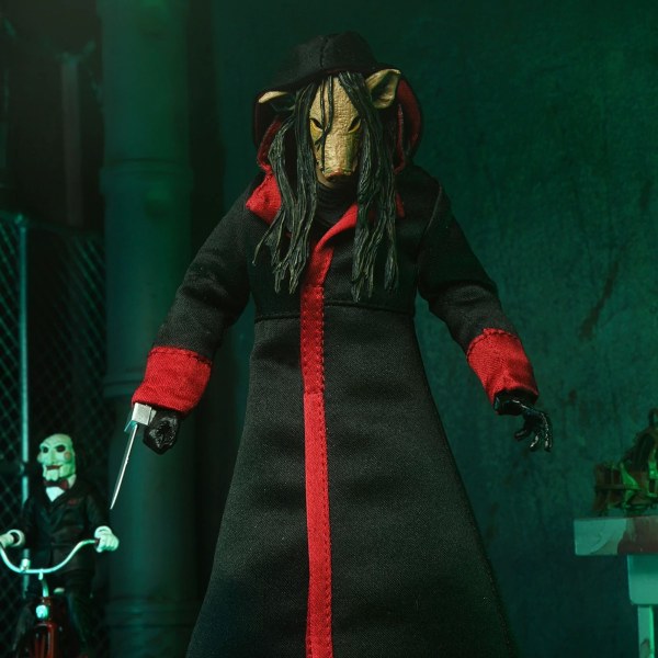 SAW (FRANQUICIA) - FIGURA DE ACCIÓN A ESCALA DE 7” - ULTIMATE JIGSAW KILLER (TÚNICA NEGRA)