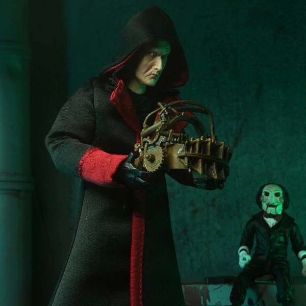 SAW (FRANQUICIA) - FIGURA DE ACCIÓN A ESCALA DE 7” - ULTIMATE JIGSAW KILLER (TÚNICA NEGRA)
