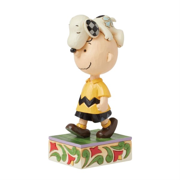 Snoopy en la cabeza de Charlie Brown - Peanuts