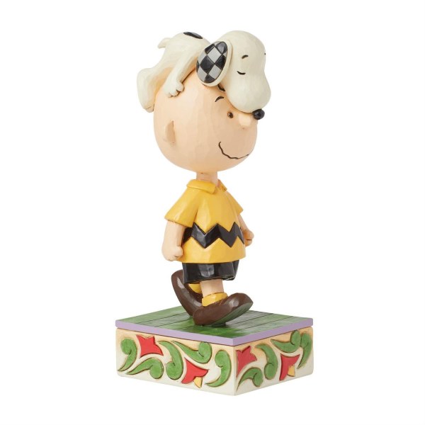 Snoopy en la cabeza de Charlie Brown - Peanuts