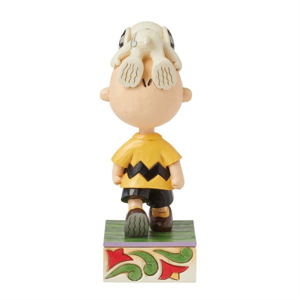 Snoopy en la cabeza de Charlie Brown - Peanuts