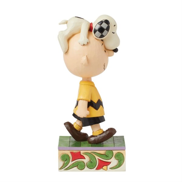 Snoopy en la cabeza de Charlie Brown - Peanuts