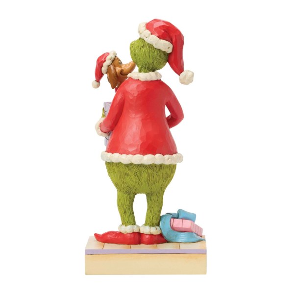 El Grinch sosteniendo un regalo - JIM SHORE GRINCH