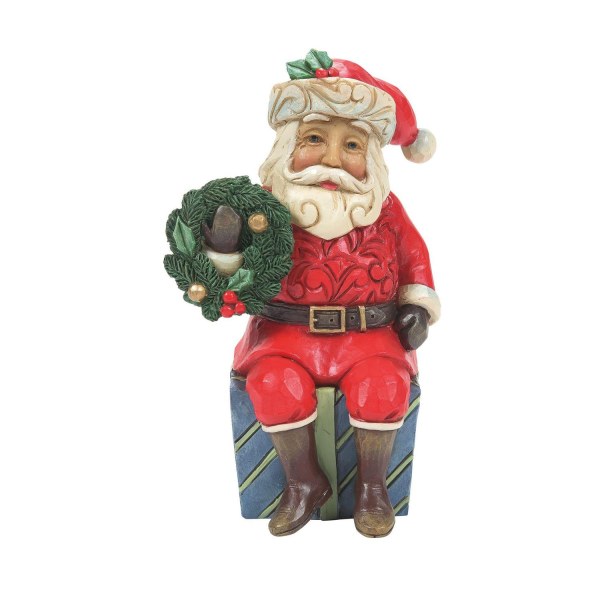 PAPÁ NOEL SENTADO SOBRE UN REGALO - JIM SHORE HEARTWOOD CREEK
